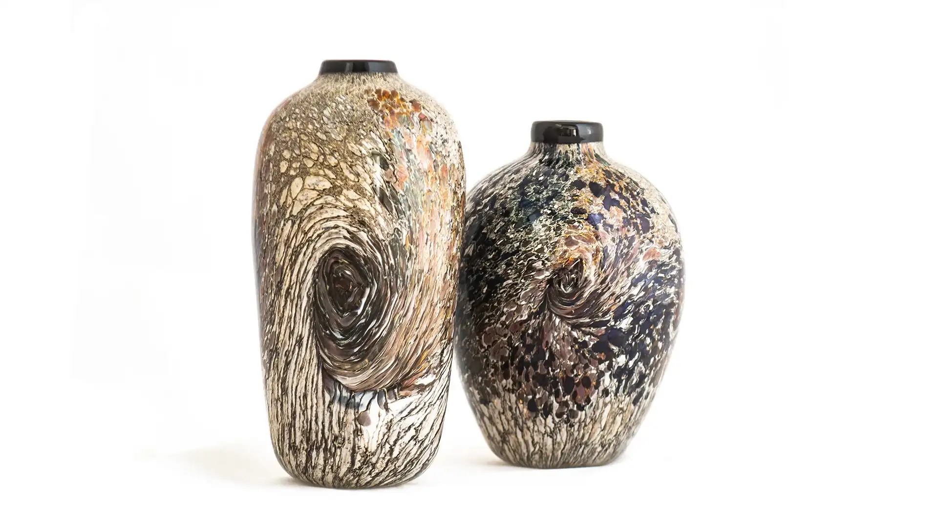 Two tall ceramic vases with swirled brown-beige glaze, placed side by side against a white background.