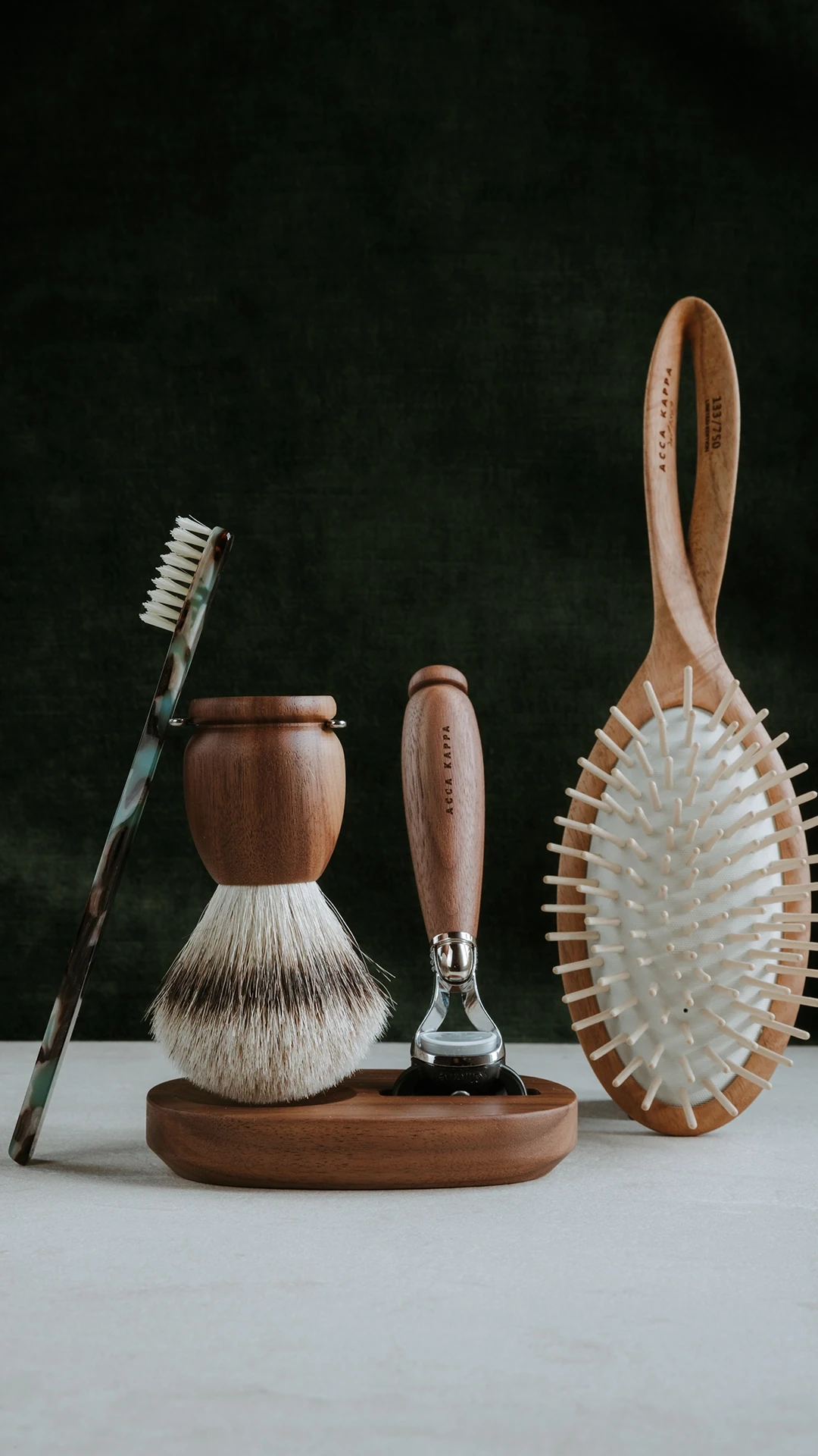Assorted wooden grooming brushes arranged on a circular wooden stand against a dark backdrop.